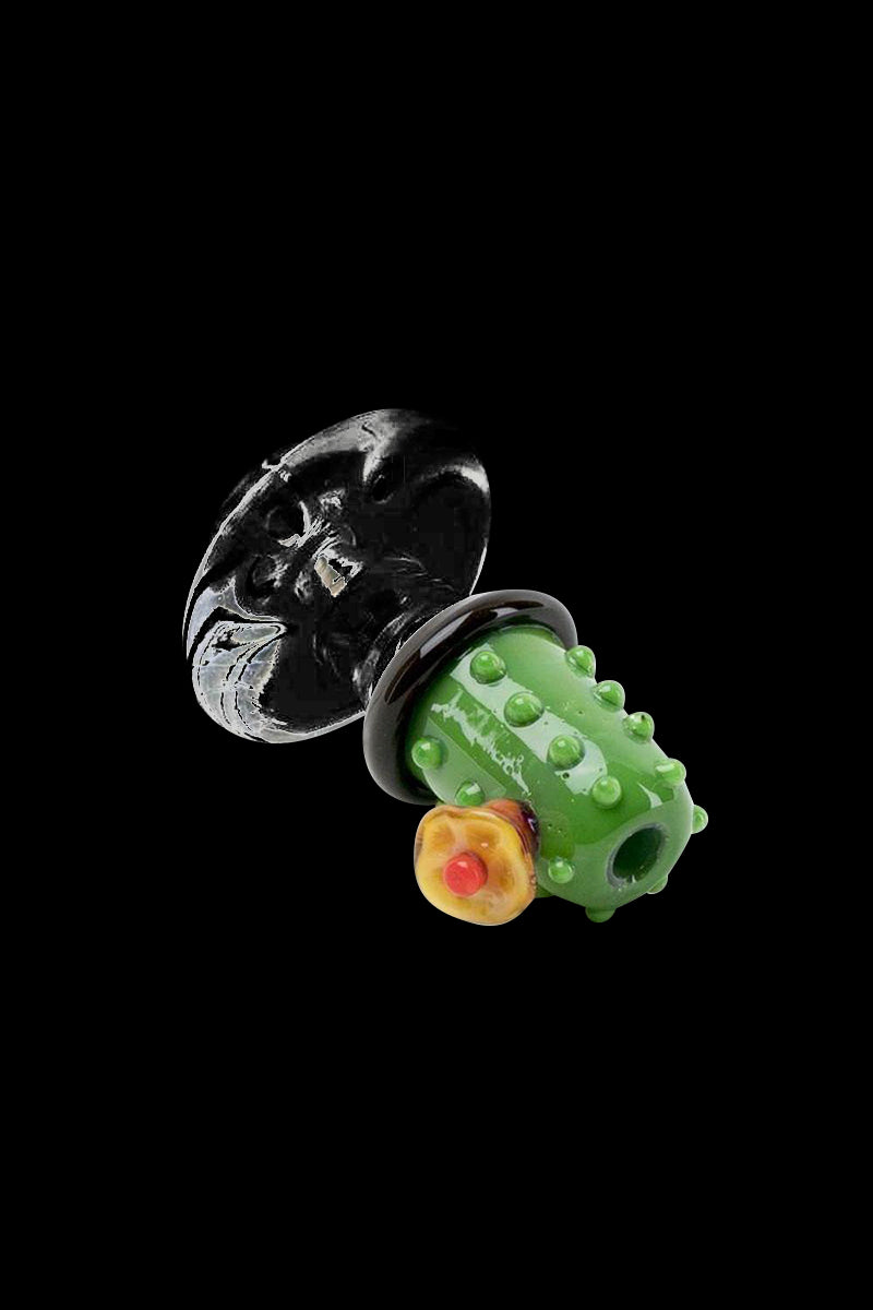 A close-up, angled view of the Empire Glassworks "Barrel Cactus" Carb Cap for Puffco Peak, showcasing its textured green glass design.