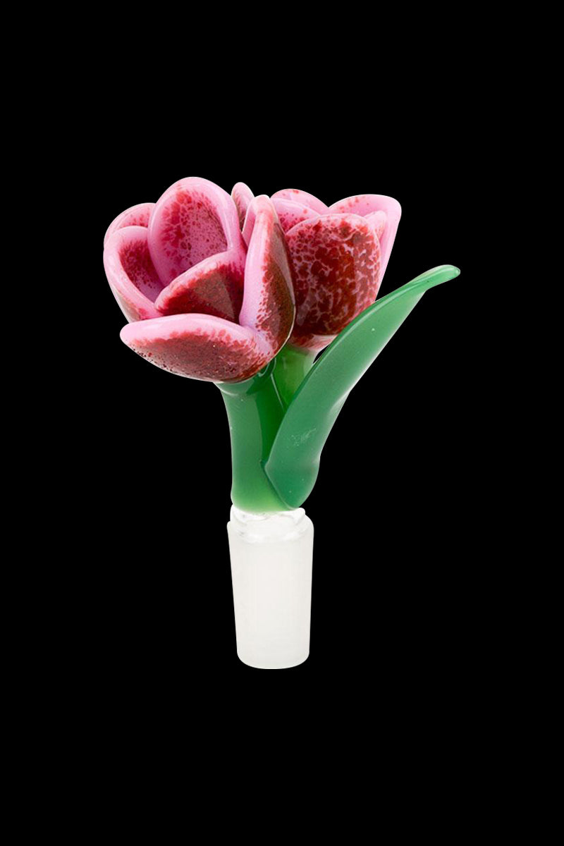 Close-up front view of the Empire Glassworks Bowl - Strawberry Cream Tulip showing a pink speckled tulip bloom with green leaves against a black background.
