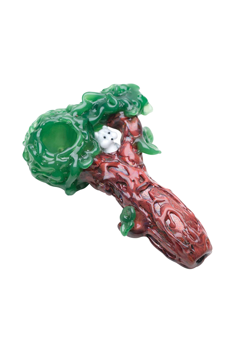 The Empire Glassworks "Squirrels Nest" Spoon Pipe is shown in a close-up, angled view, featuring a textured, green and brown design resembling a nest.