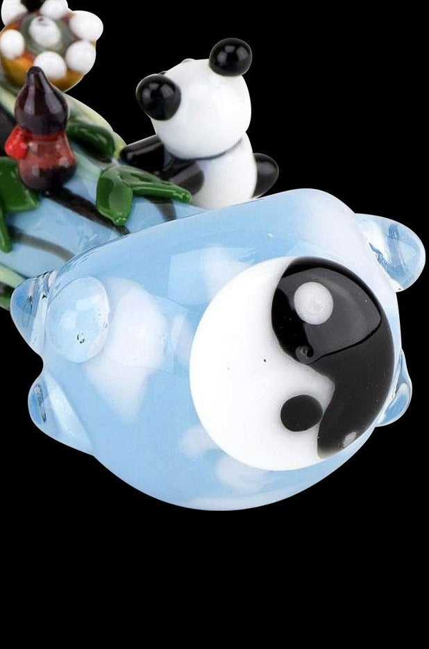 A close-up of the Empire Glassworks Spoon Pipe - Climbing Pandas, showing a sculpted panda clinging to the bowl’s clear glass exterior.