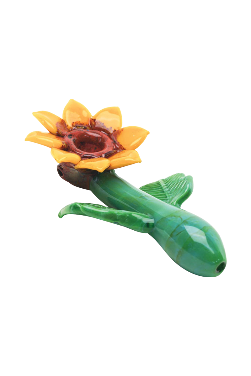 Front view of the Empire Glassworks Sunflower Hand Pipe, showcasing a detailed, yellow flower-shaped bowl on a curved stem.