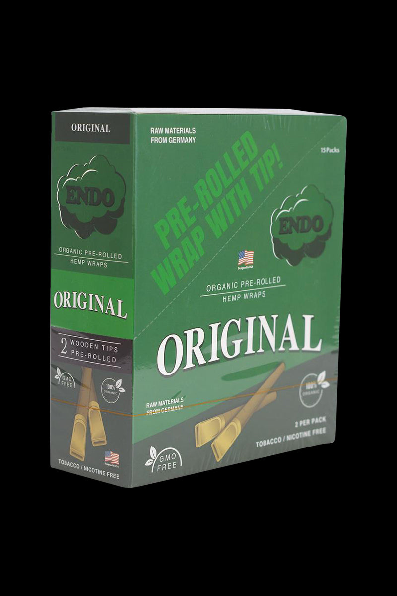 Angled view of a green box labeled Endo Pre-Rolled Hemp Wraps - 15 Pack with "ORIGINAL" text and printed wooden tip illustrations on a black background