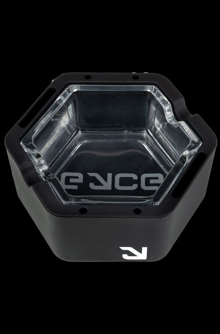 Black cannabis concentrate container with clear interior and branded logo.