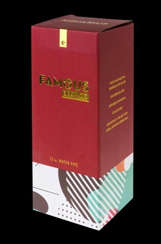 Tall front three-quarter view of the Famous Brandz "Aquarius" 12" Glass Water Bong in its red and patterned retail box against a black background