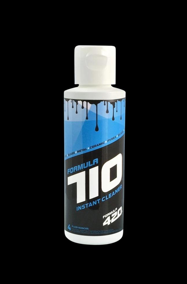 Front-facing bottle shot of Formula 710 Instant Cleaner (Small 4oz) with blue and black label details on a black background