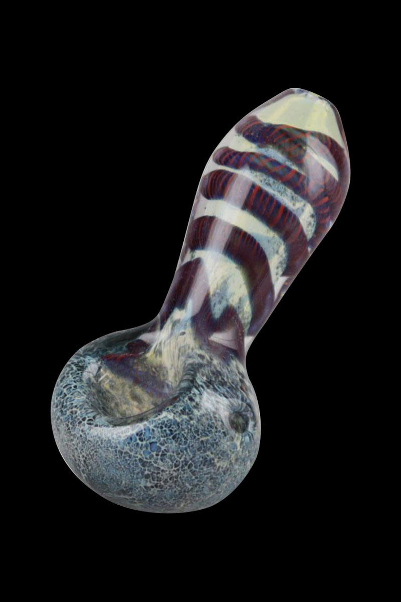 Angled close-up of the Smoke Cartel Frit & Cord Worked Spoon Hand Pipe showing a bulbous blue-speckled bowl and a twisted red-and-white corded neck against a black background