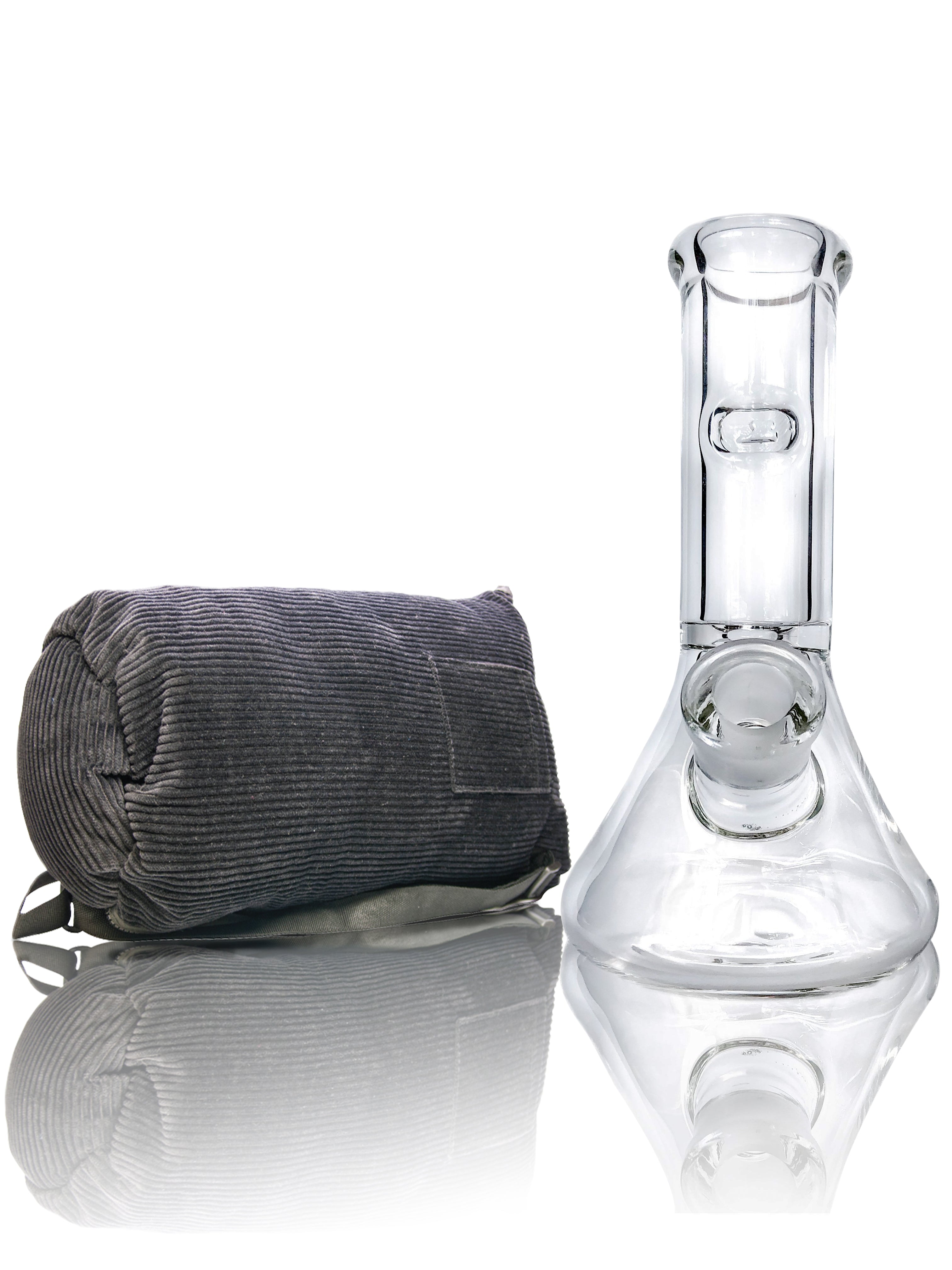 Front view of the Tank Glass Mini beaker bong, reflecting in a shiny surface with a soft, diffused light.