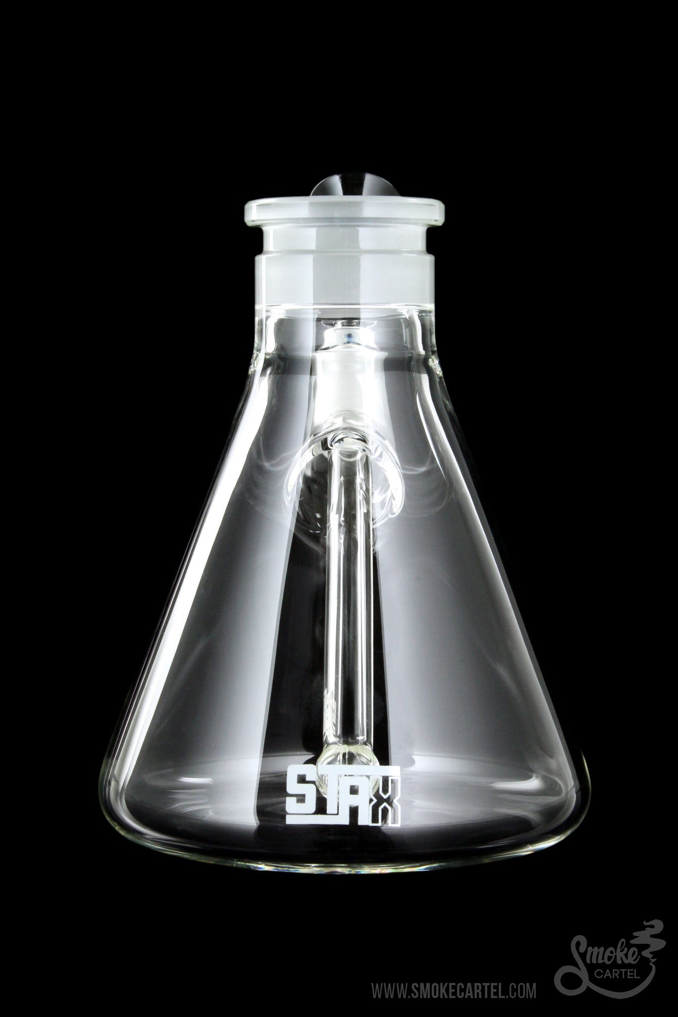 Front view of the GRAV® STAX Beaker Base, a clear glass base with a simple, cylindrical shape and clean lines.
