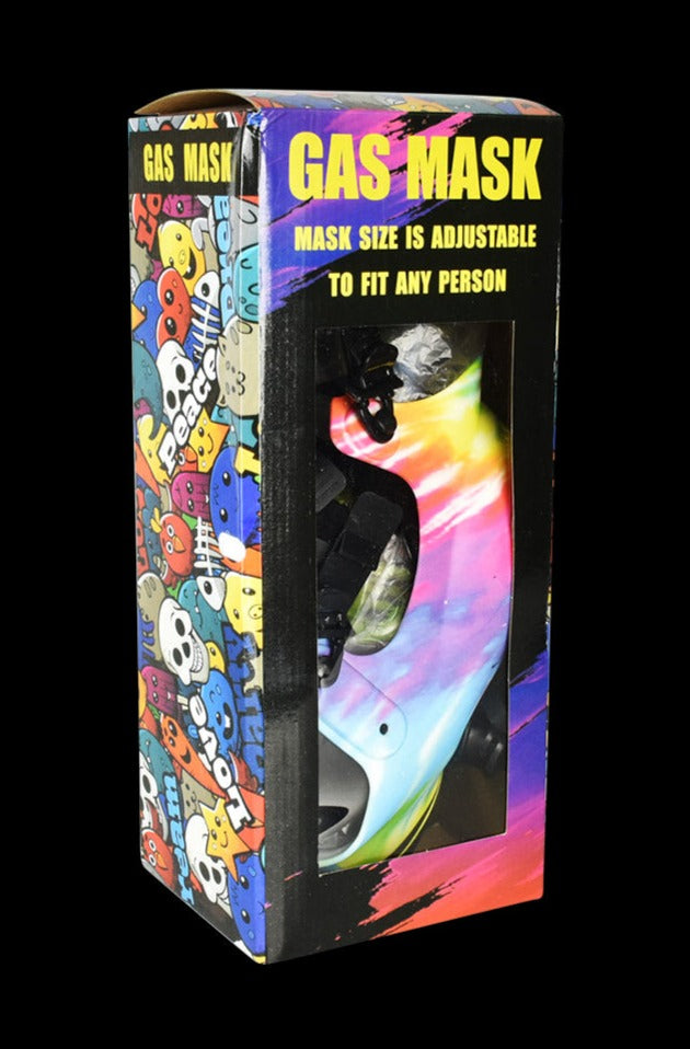 Angled front view of the Gas Mask with Acrylic Bong in colorful skull packaging, showing the tie-dye gas mask through a clear window.