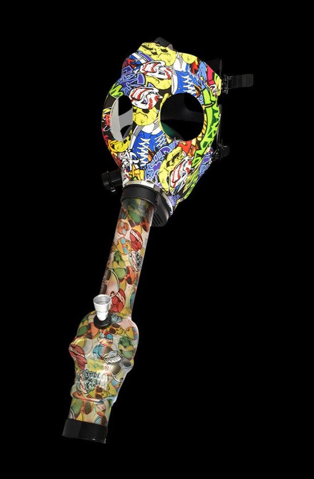 Angled view of a Gas Mask with Acrylic Bong featuring a colorful skull-and-cartoon patterned mask and matching long neck against black.