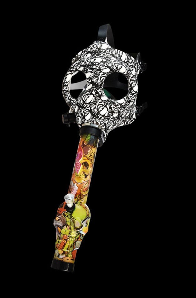 Front-lit view of the Gas Mask with Acrylic Bong featuring a black-and-white skull-patterned gas mask attached to a colorful, graffiti-style acrylic bong against a black background