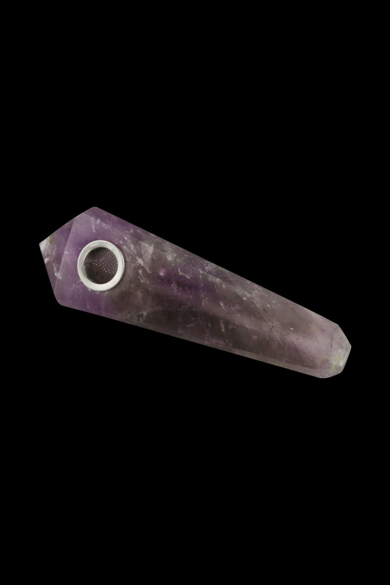 Angled close-up of a purple Natural Gemstone Mineral Hand Pipe, polished astrophyllite-style stone with a metal bowl against a black background