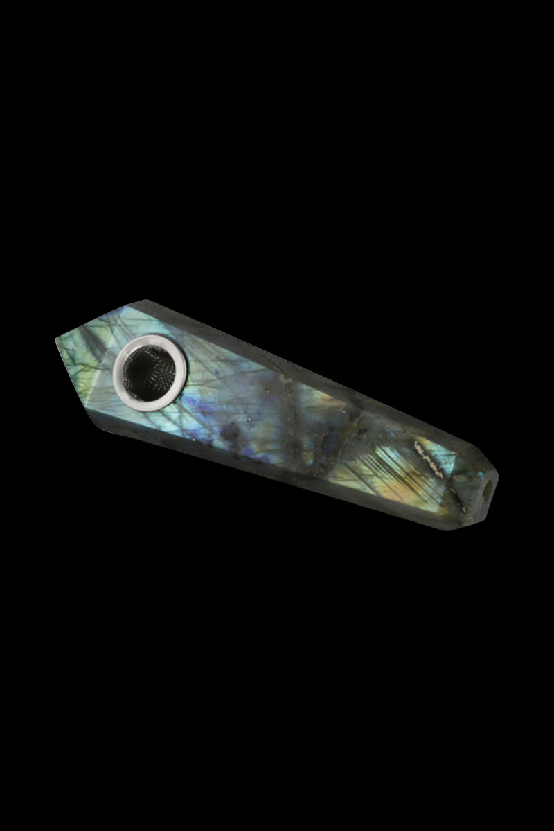 Angled close-up of a Tiger Eye Natural Gemstone Mineral Hand Pipe showing iridescent blue-green flash on a faceted stone body against a black background