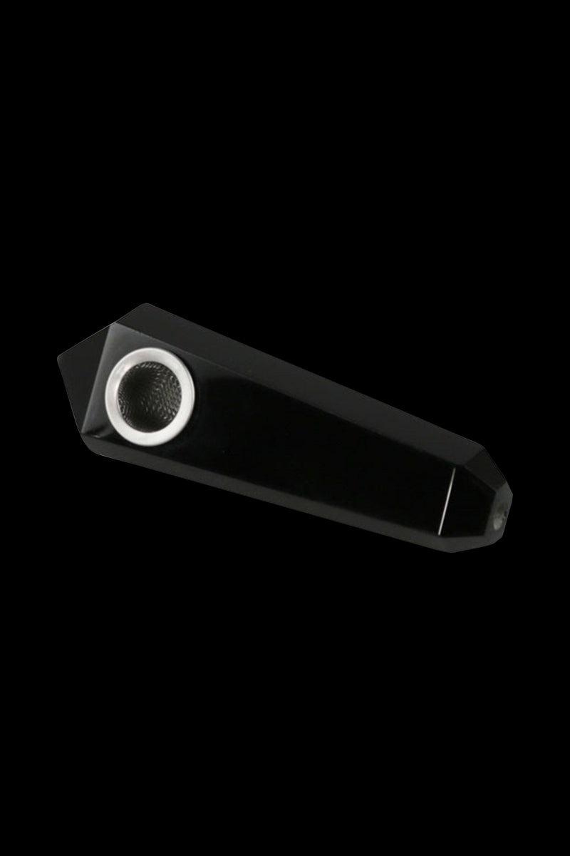 Angled close-up of the Natural Gemstone Mineral Hand Pipe in shiny red crystal showing its faceted, elongated body and metal bowl against a black background