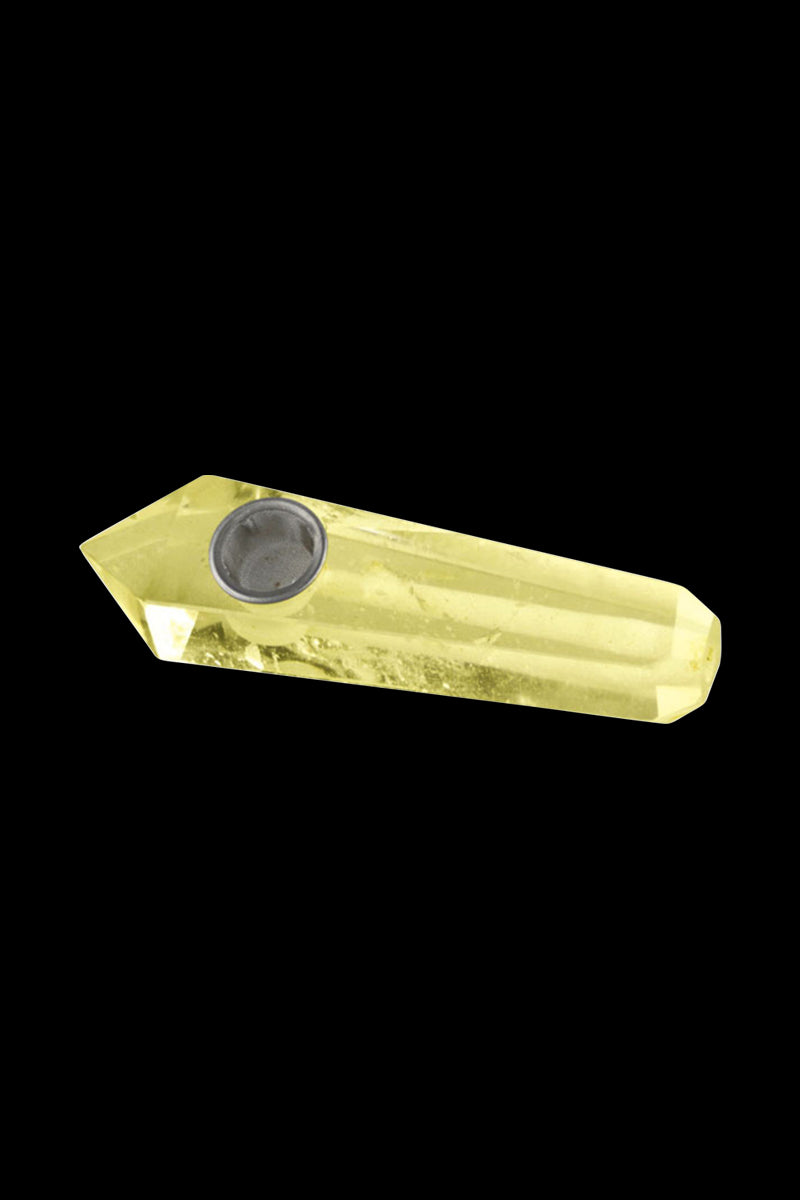 Angled close-up of a yellow crystal pipe against black background showing the faceted point and metal bowl of the Natural Gemstone Mineral Hand Pipe