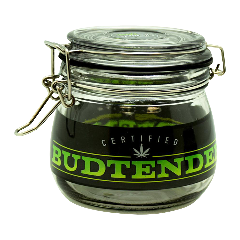 Three-quarter view of a clear glass Dank Tank "Budtender" Airtight Glass Storage Jar with a metal clamp lid and a black label reading BUDTENDER in bright green.