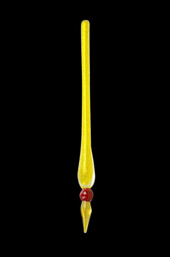 Center-aligned glow-in-the-dark Dabber Tool shown vertically on black, the slender yellow glass rod tapering to a red bead and pointed tip.