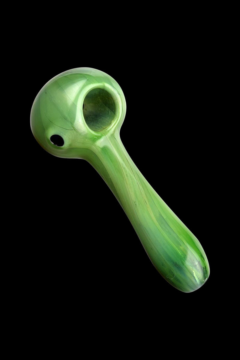 A three-quarter view of the Hard Candy Spoon Pipe - Green Apple, showcasing its smooth, curved shape and glossy finish.