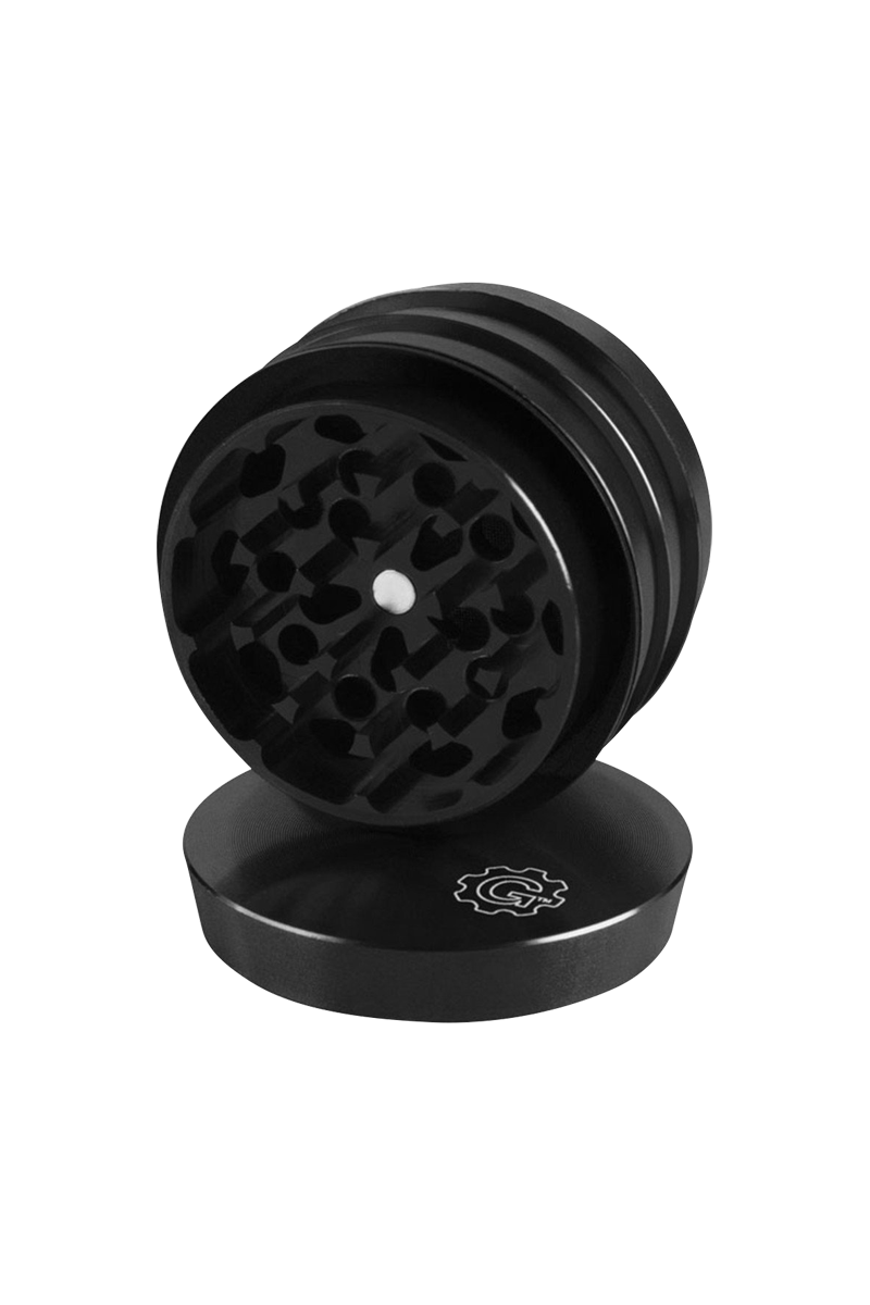 A close-up, angled view of the Pulsar 2 Aluminum Tiered 4pc Grinder, showcasing its stacked, metallic tiers and textured grinding surfaces.