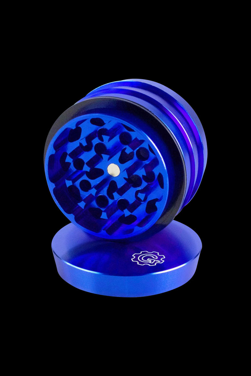 A three-quarter view of the open Pulsar 2 Aluminum Tiered 4pc Grinder, displaying its tiered interior and metallic blue finish.