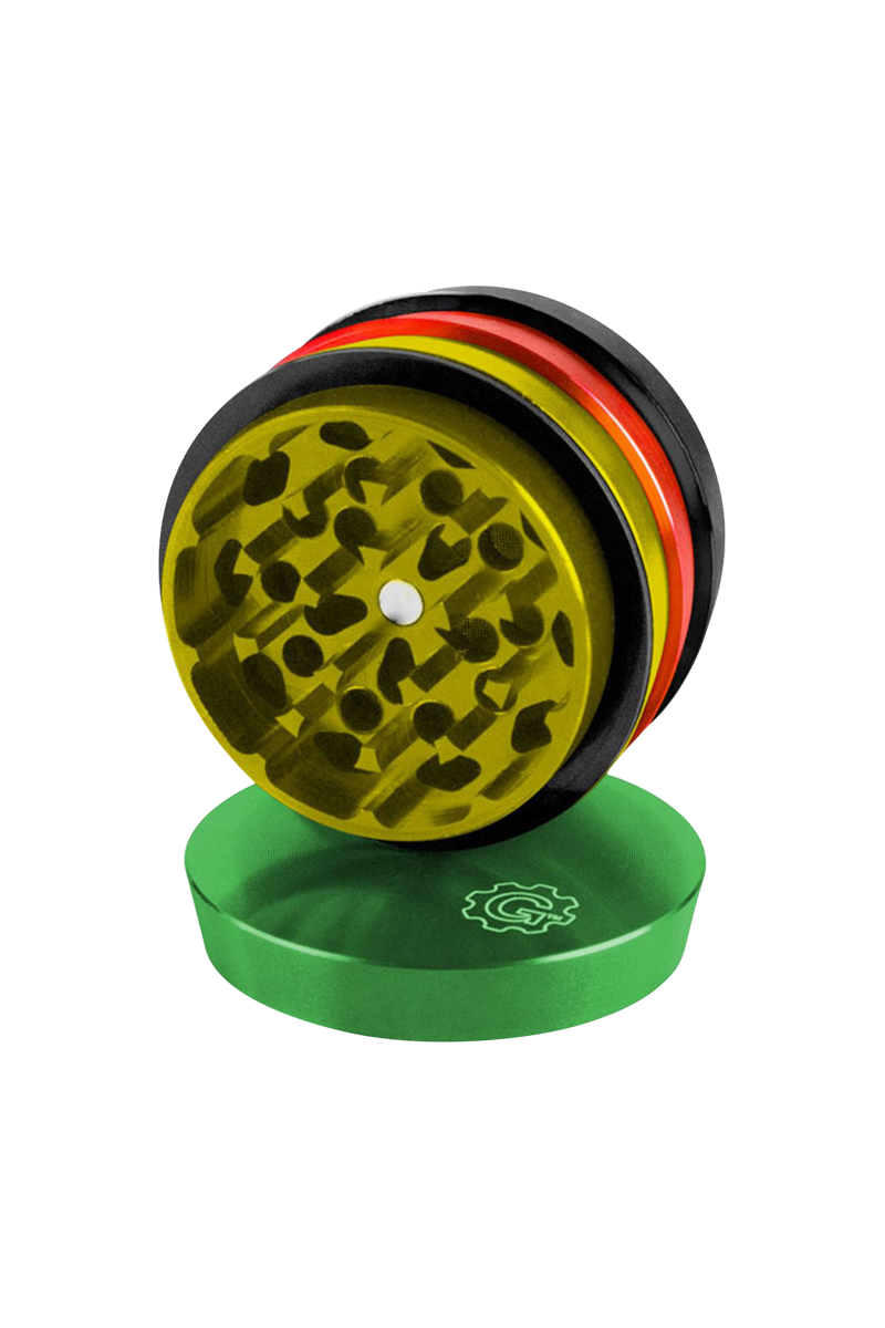 A close-up, angled view of the Pulsar 2 Aluminum Tiered 4pc Grinder, showcasing its metallic tiers and textured grinding surfaces.