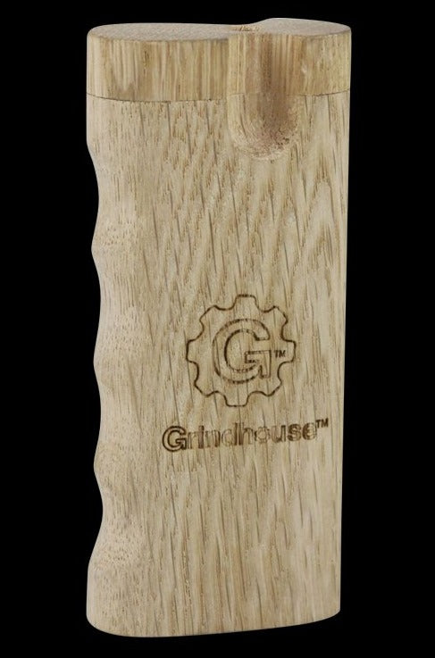 Front-facing view of the Pulsar Curved Wood Dugout showing its light wood grain, finger grooves, and burned Grindhouse logo on a black background.
