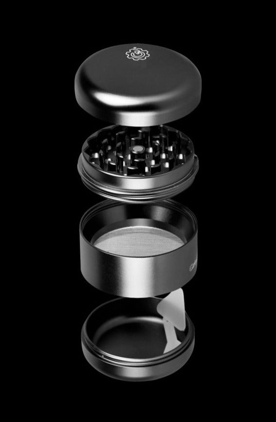 A disassembled view of the Pulsar Matte Grinder – 4 Piece, showcasing its four individual parts stacked against a dark background.