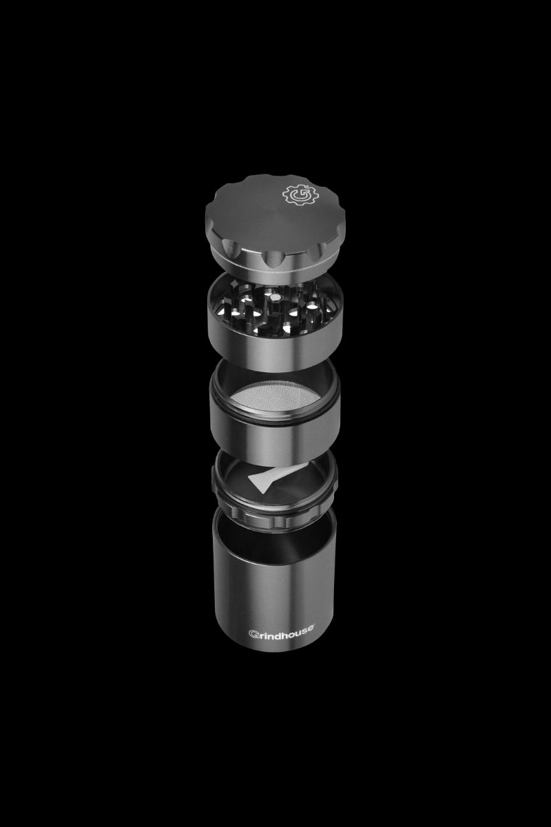 A close-up, angled view of the Pulsar Metal Storage and 4-Piece Grinder, showcasing its stacked, cylindrical metal components.