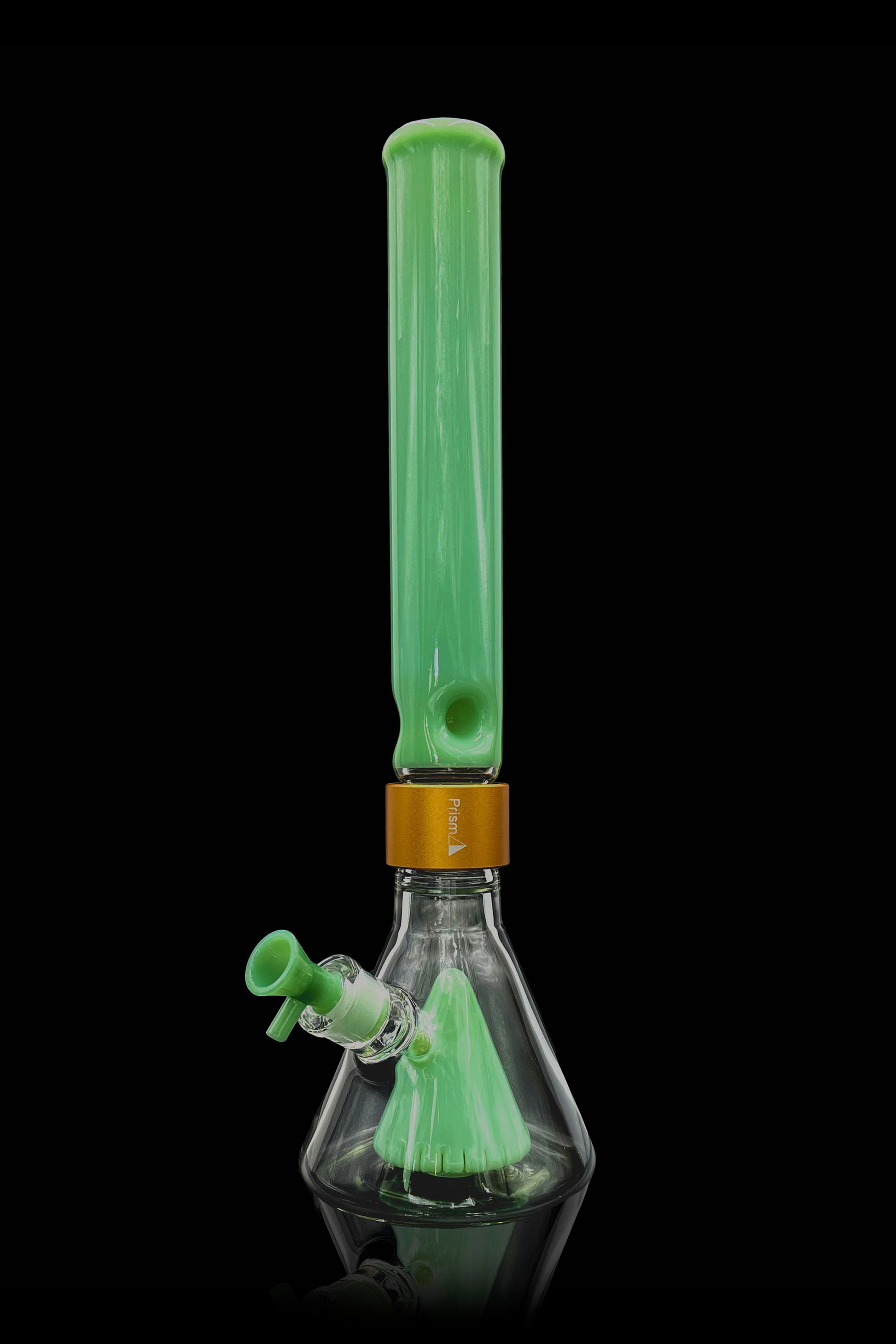 Green glass bong with water visible inside, studio shot on a black background.