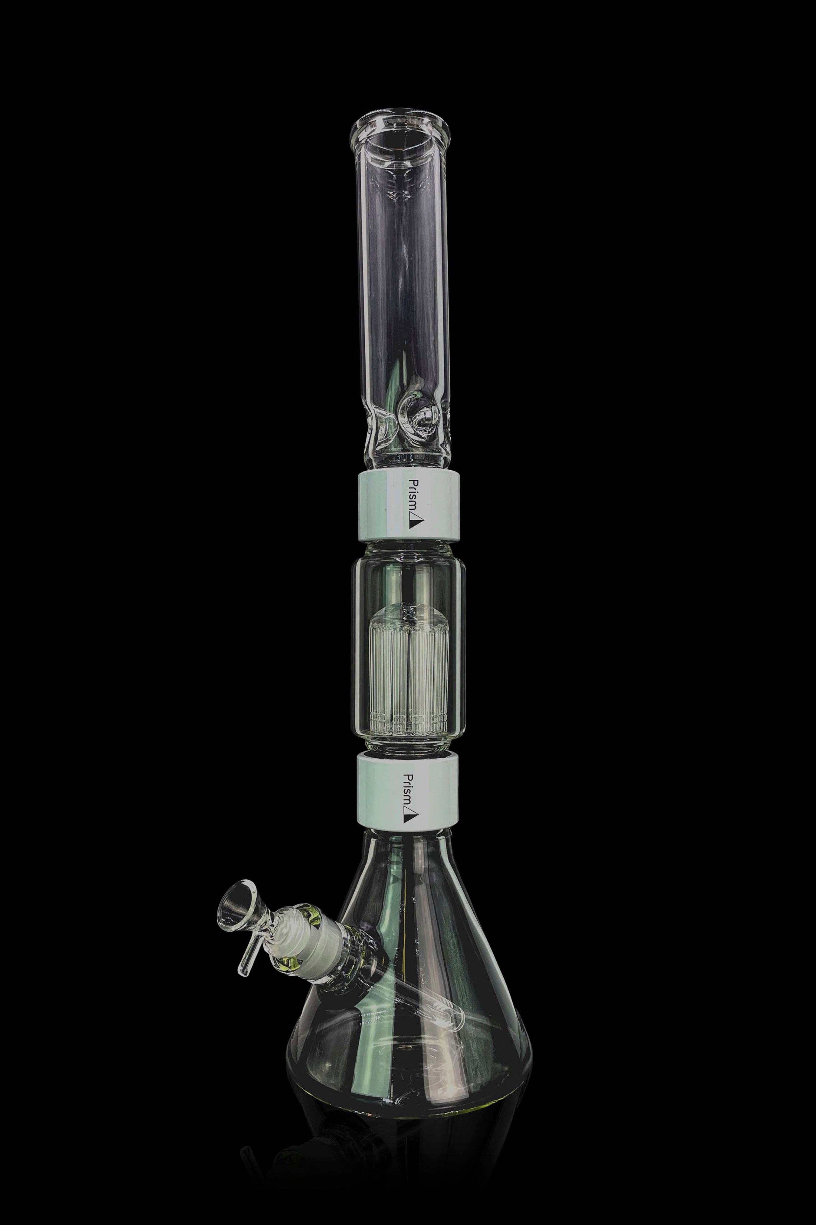 A glass bong with multiple filtration chambers, isolated on a black background.