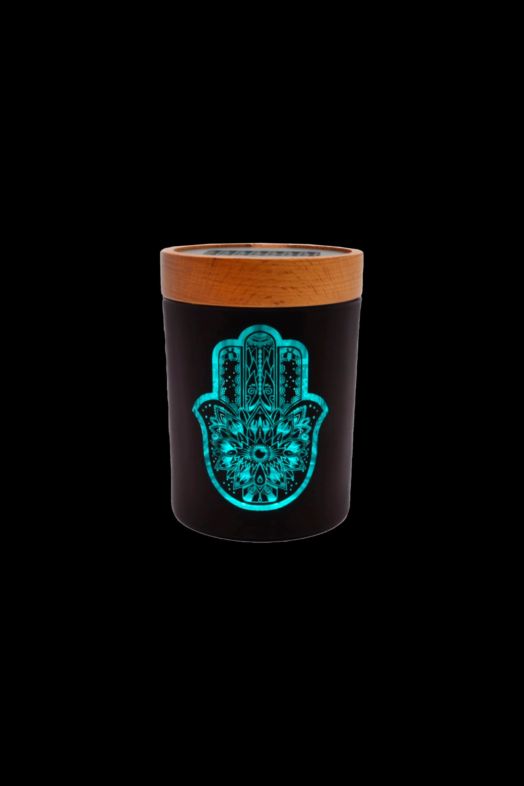 Black and wood cannabis storage jar with a glowing blue hamsa hand design.