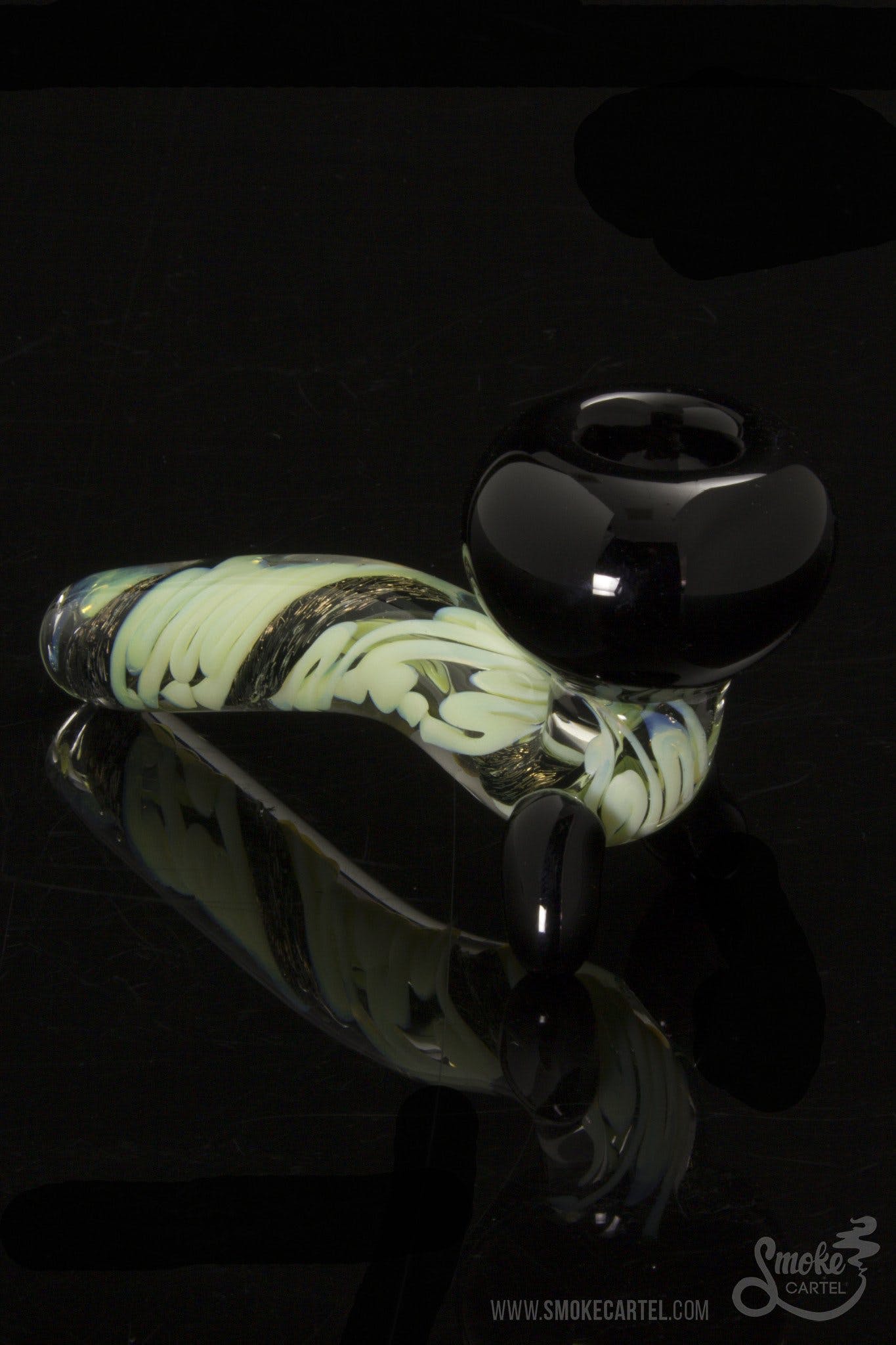 A studio shot of the LA Pipes Mini Sherlock with Slyme Cane and Dichro, displaying its curved bowl and colorful glasswork against a black backdrop.