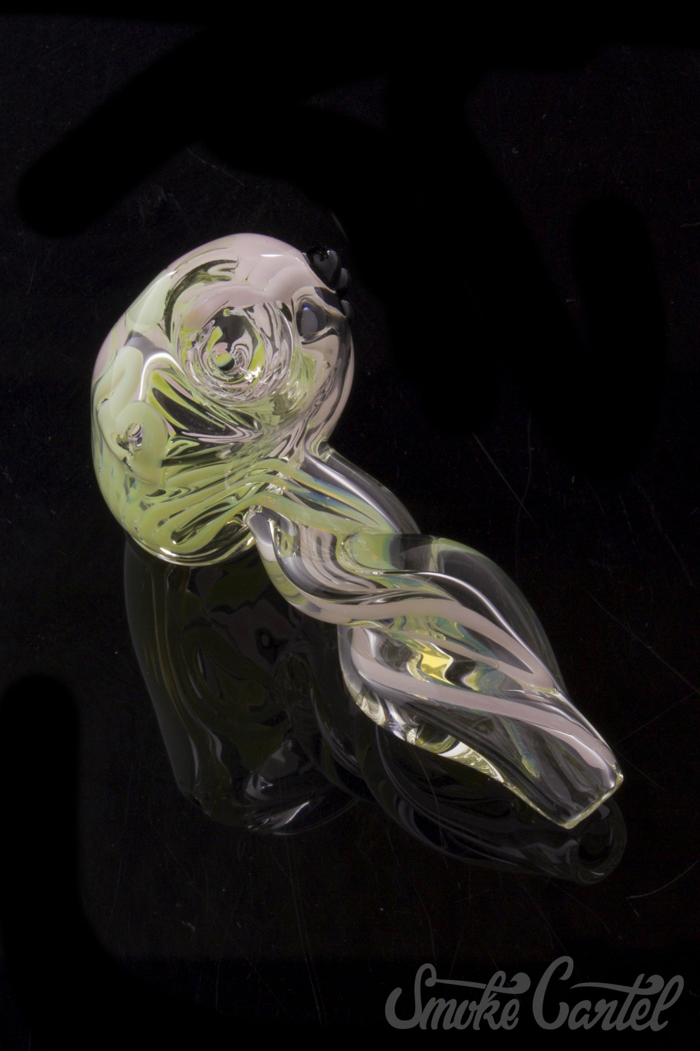 A close-up, angled view of the Green Slyme and Bubble Gum Inside-Out Pipe with Black Marbles, highlighting its translucent glass swirls.