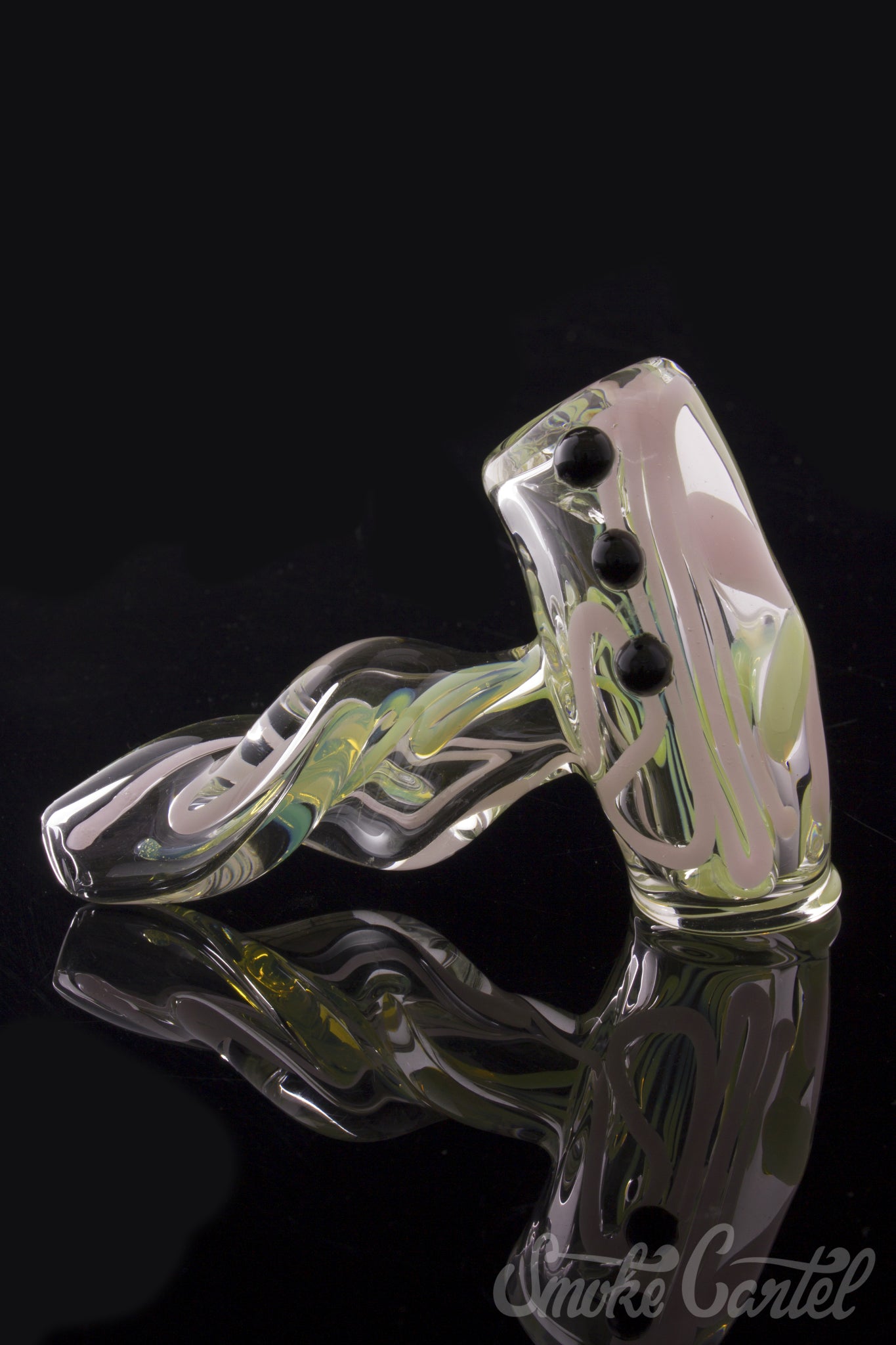 A close-up shot of the Green Slyme and Bubble Gum Inside-Out Pipe with Black Marbles, showing its swirling glass design and black marble accents.