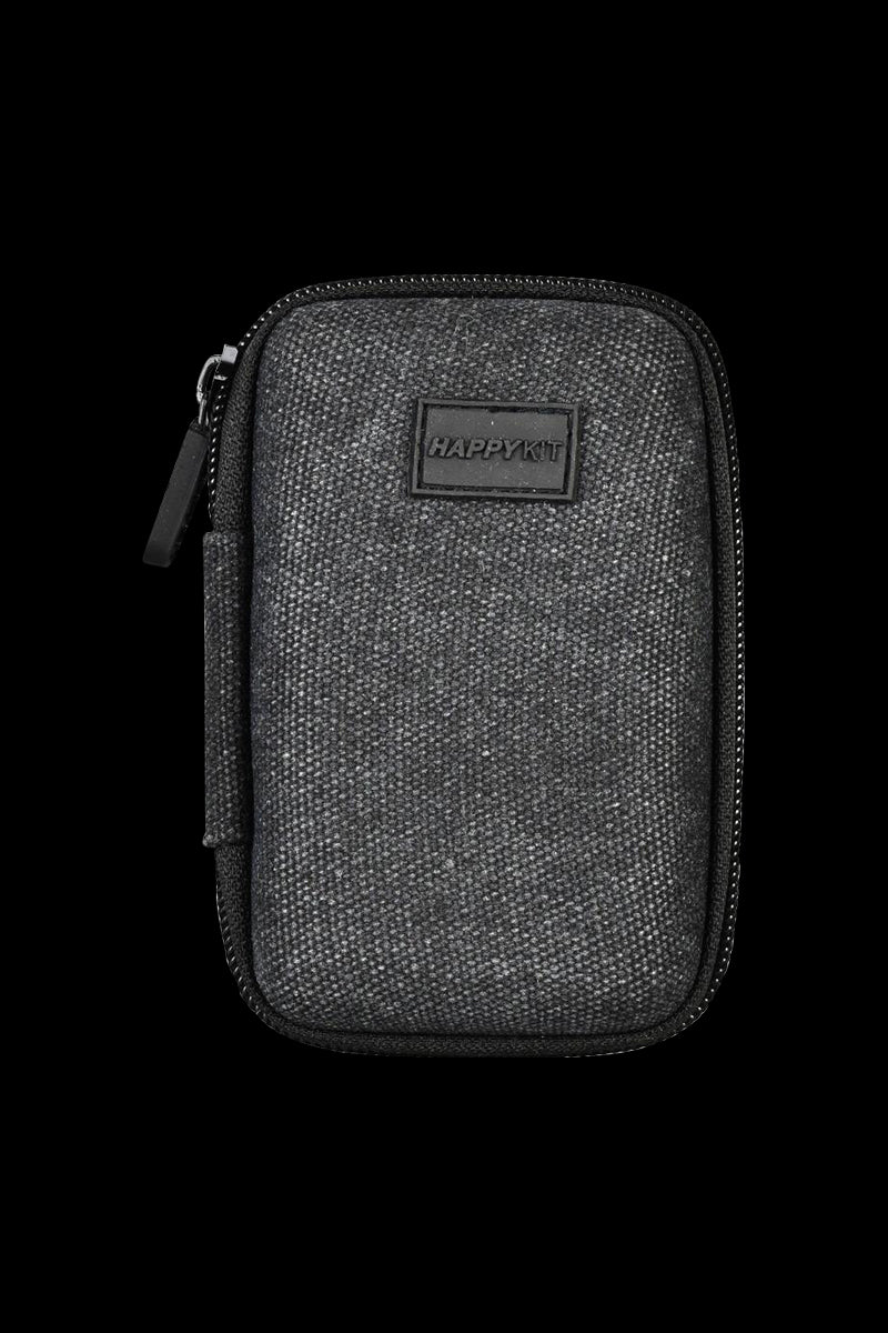 A close-up shot of The Happy Dab Kit Mini, showcasing its textured black exterior and compact zippered design.