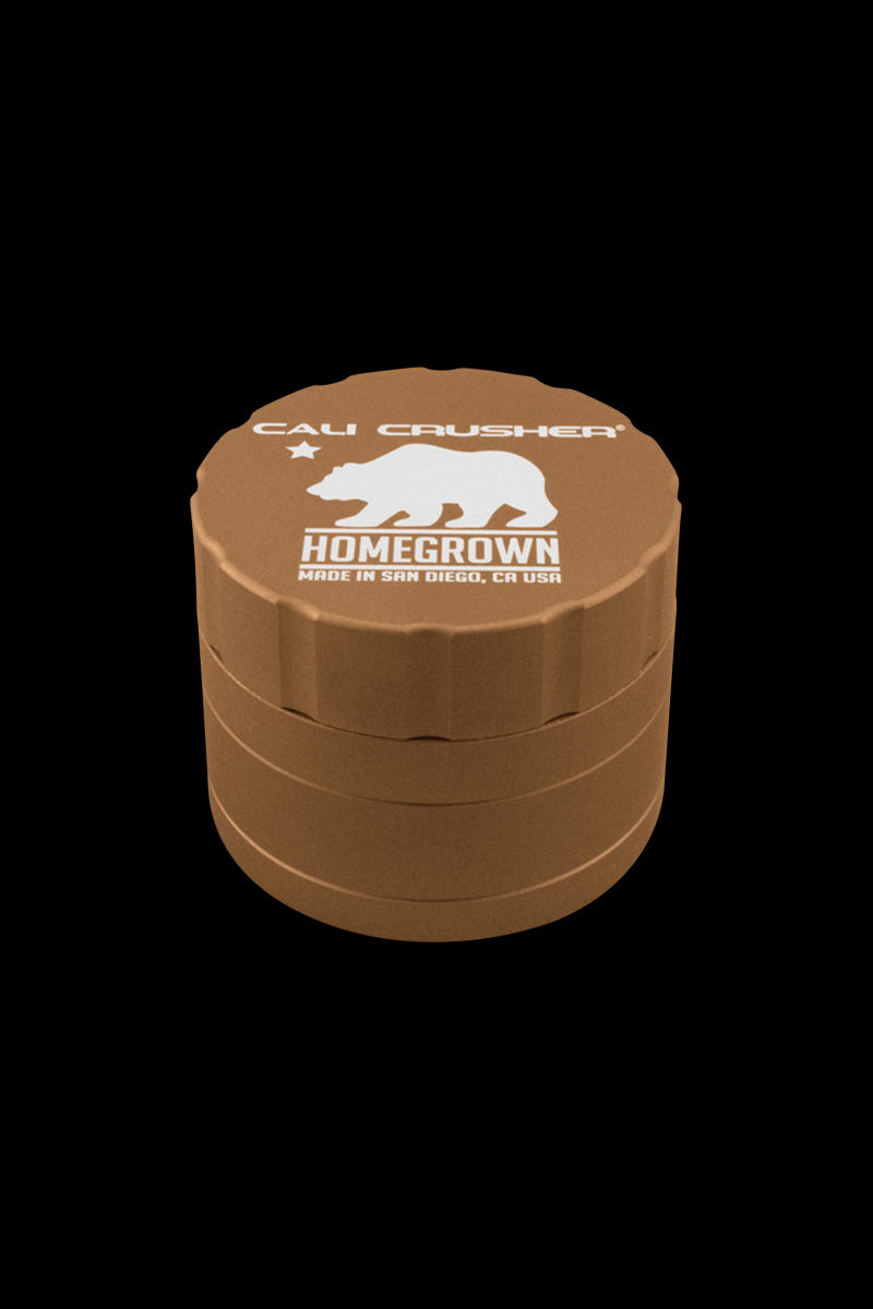 Close-up front view of the Cali Crusher Homegrown 4 Piece Grinder with Quicklock in matte bronze against a black background.