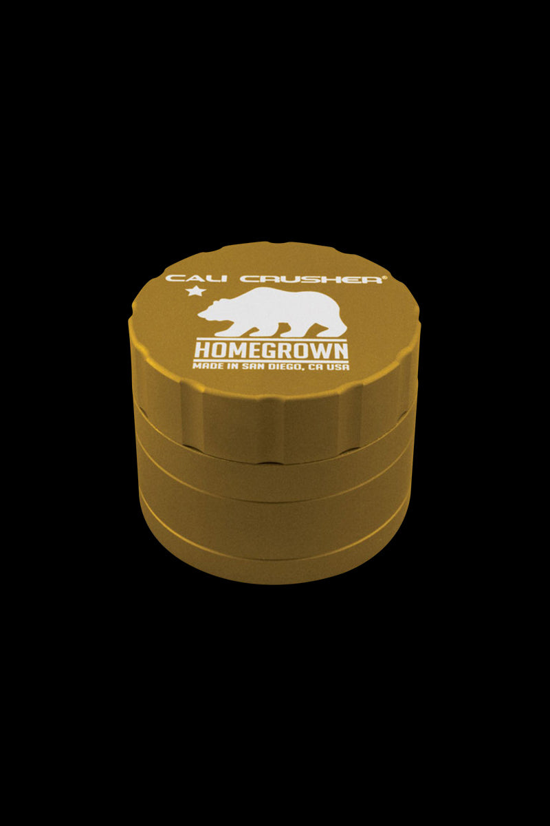 Top-down view of the gray Cali Crusher Homegrown 4 Piece Grinder with Quicklock showing its stacked cylindrical layers and white bear logo on the lid.