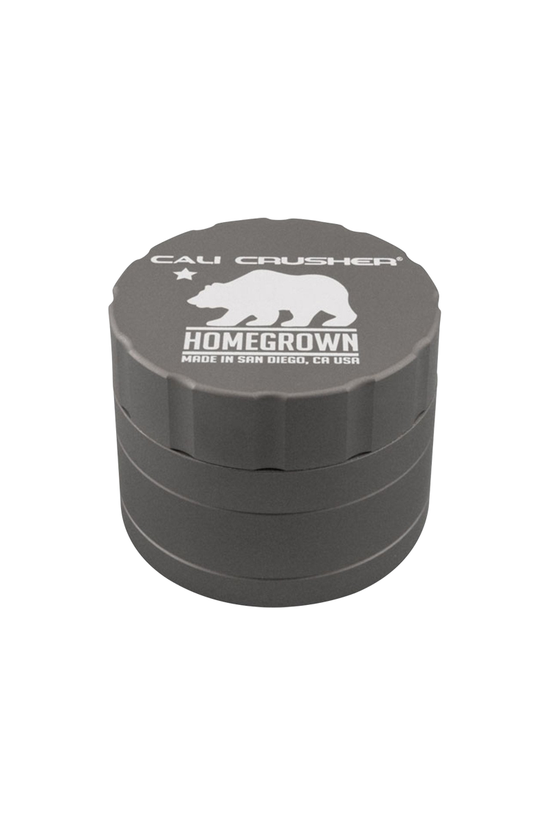 Top-down view of a gray Cali Crusher Homegrown 4 Piece Grinder with Quicklock showing its white bear logo and ridged lid edges.