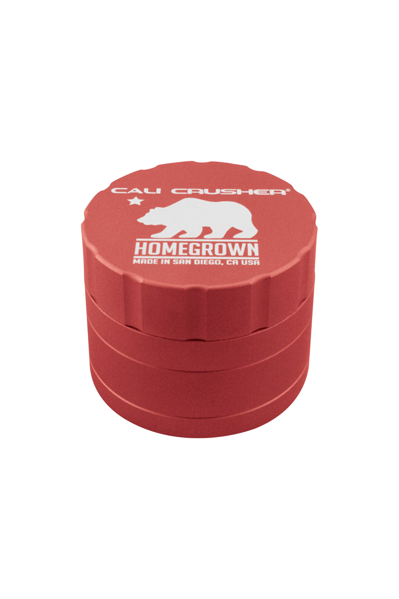 Top-down view of the red Cali Crusher Homegrown 4 Piece Grinder with white bear logo and stacked ridged layers.