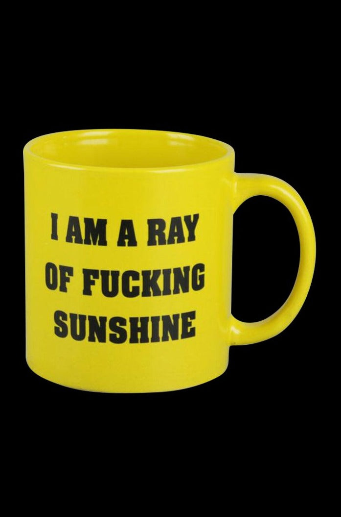 Front view of the “Mug - I am a Ray of Fucking Sunshine” with black text on a yellow background, showing the handle on the right.