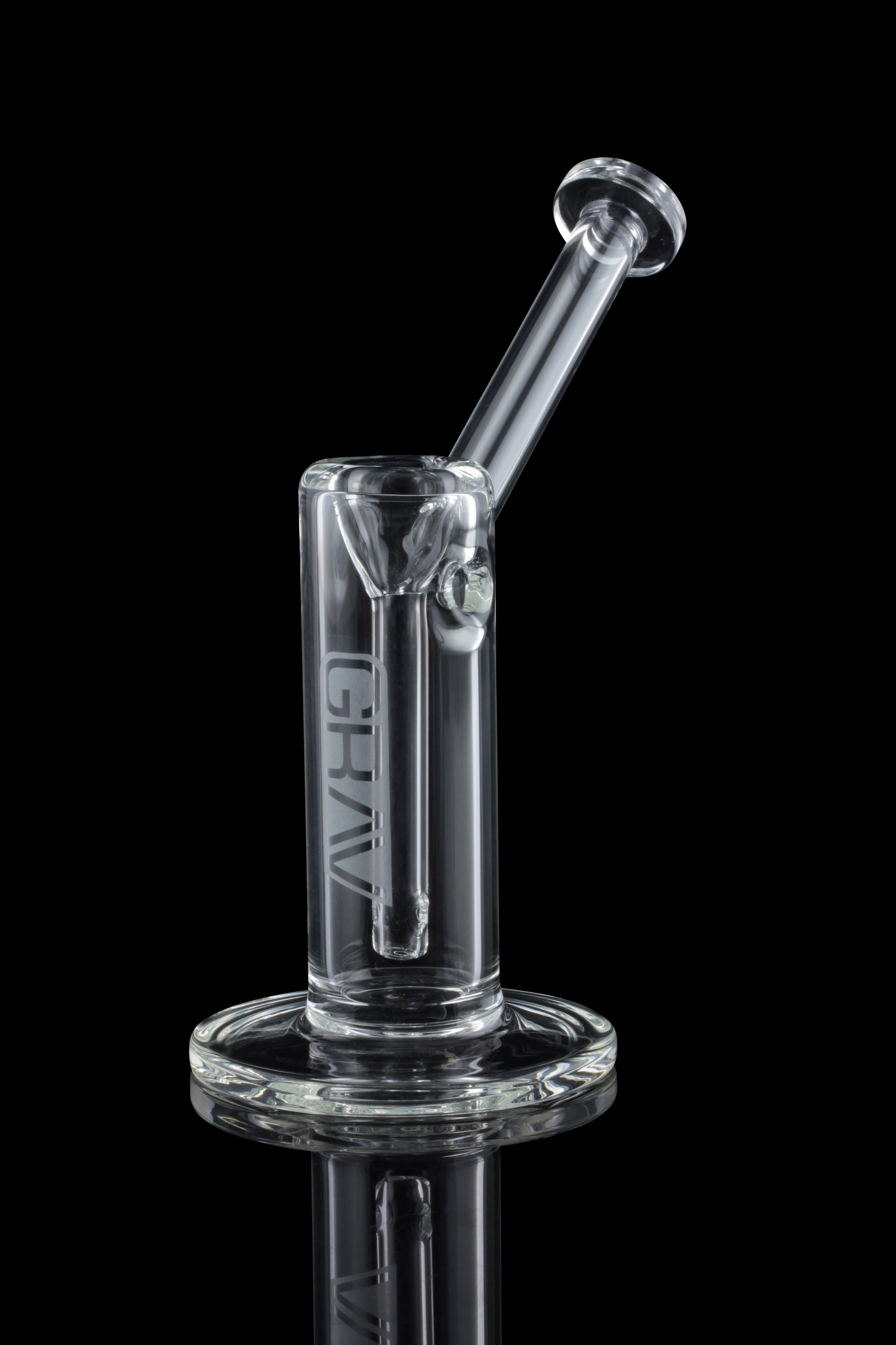 Clear glass oil rig with a bubbler and angled mouthpiece, displayed against a black background.