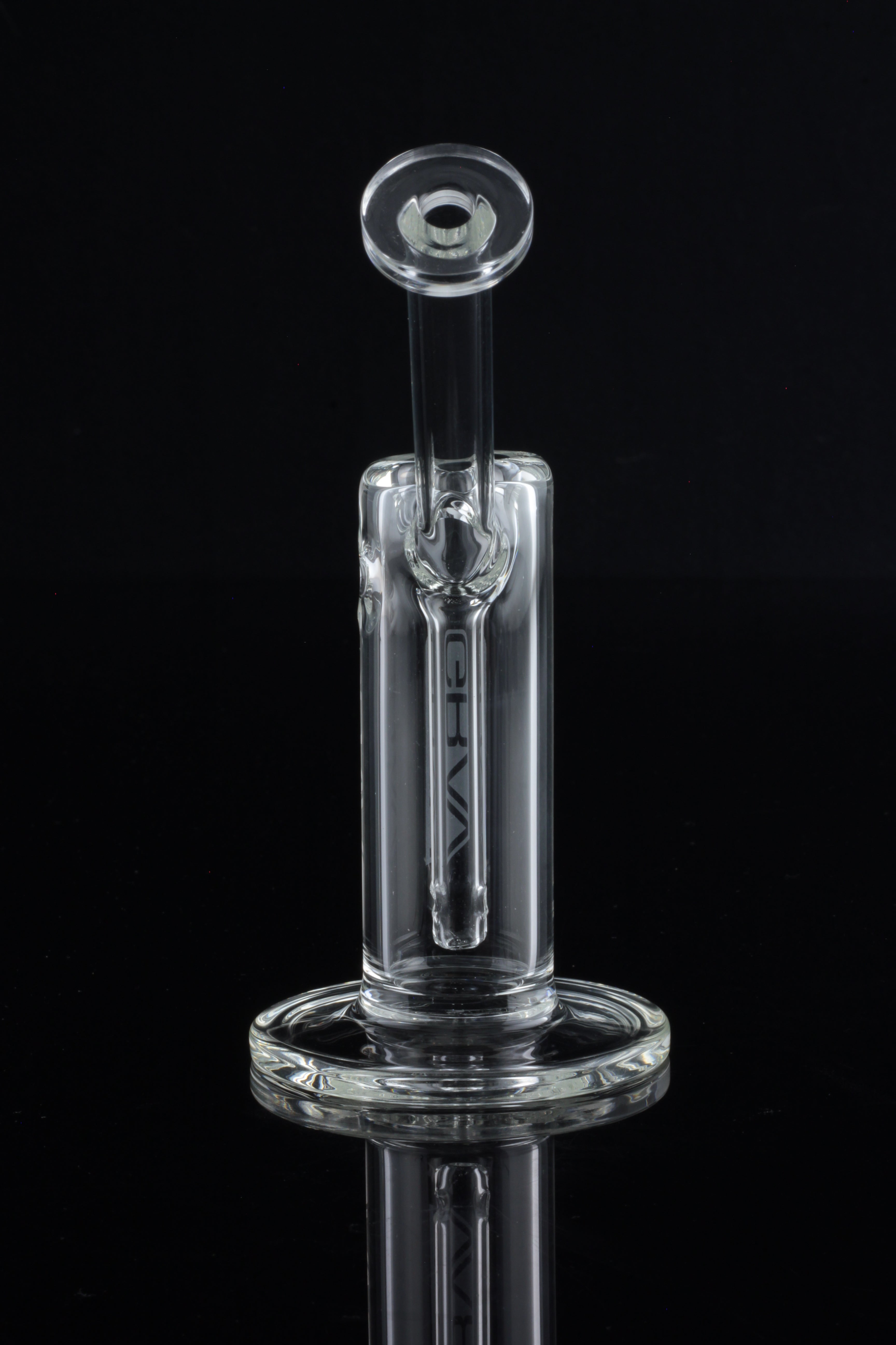 Clear glass oil rig with a cylindrical body and spherical percolator, displayed against a black background.