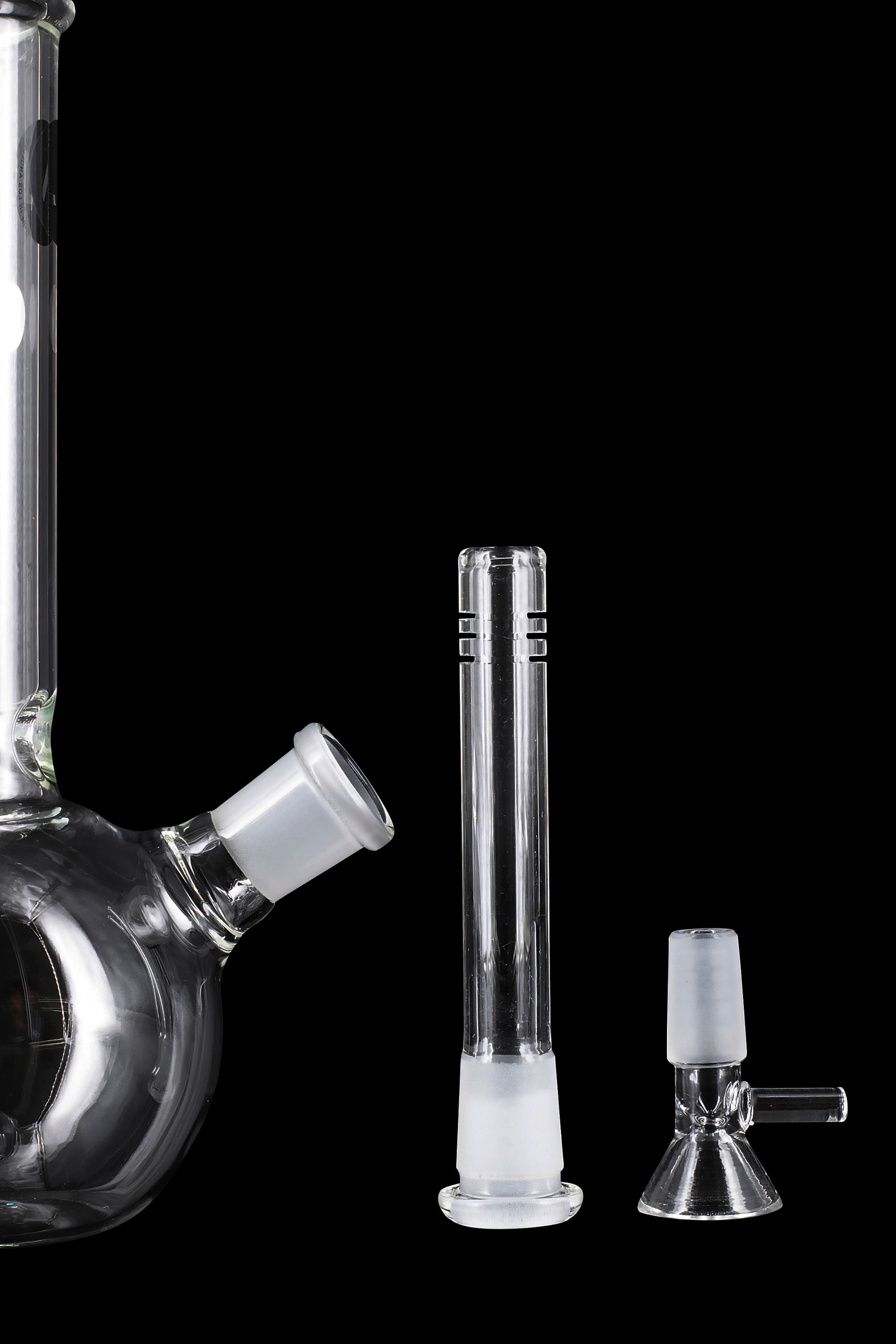 Glass water pipe components including a beaker base, downstem, and bowl, isolated on a black background.