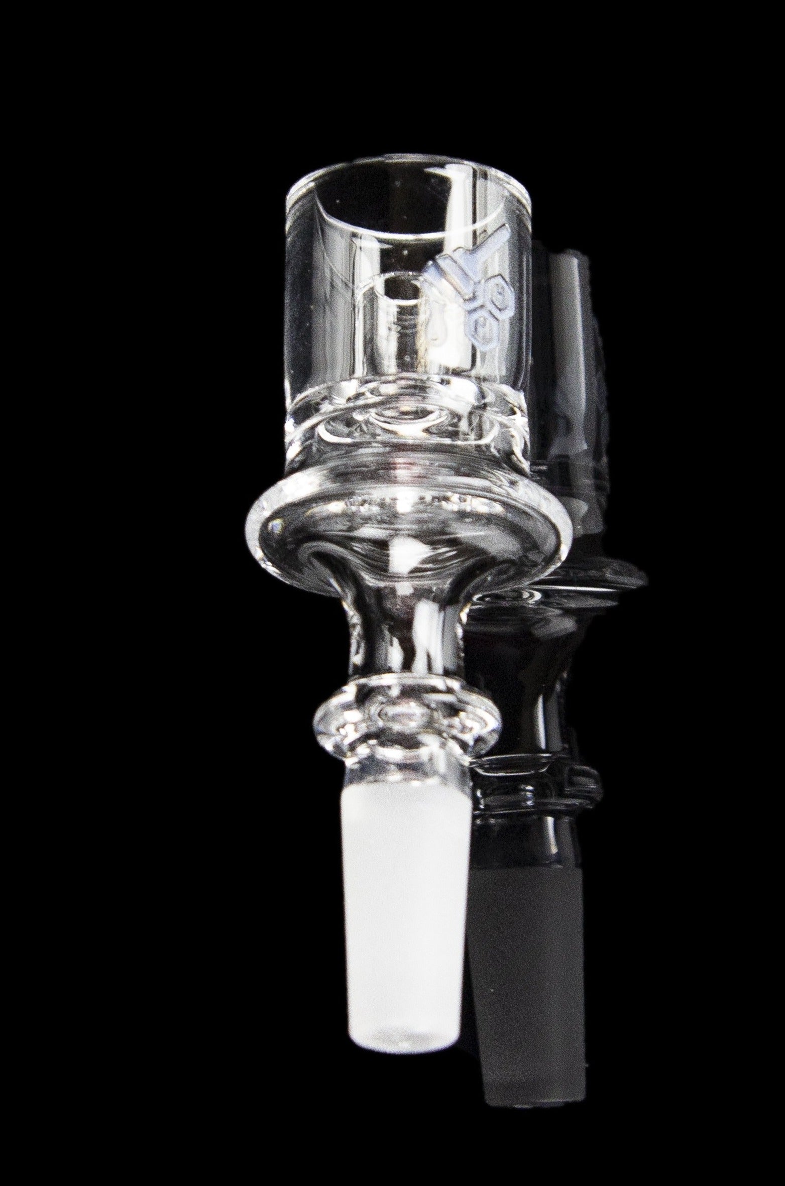 Clear glass dab rig with a textured bulb and joint for attachment, isolated on a black background.