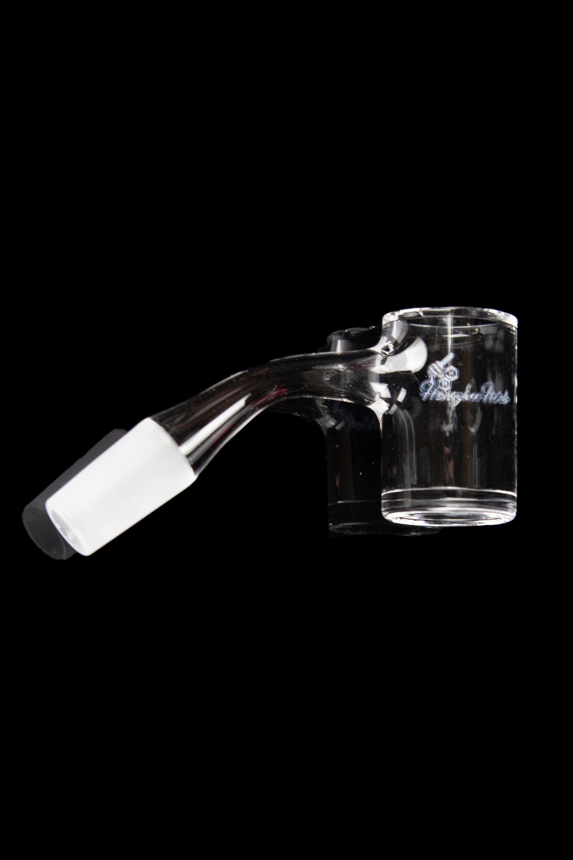 Clear glass dab rig with etched design on black background.