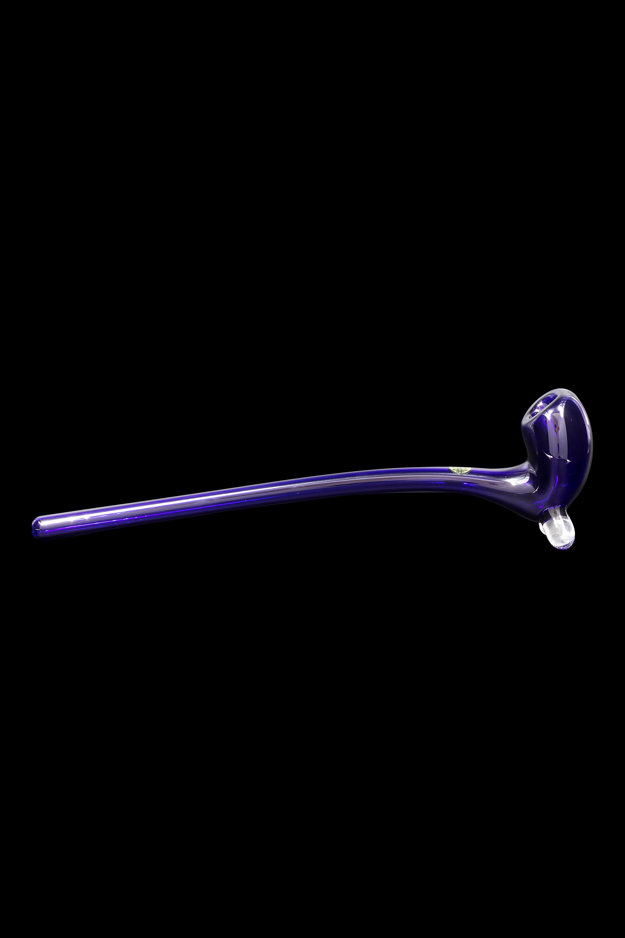 Purple glass cannabis oil burner pipe isolated on a black background.