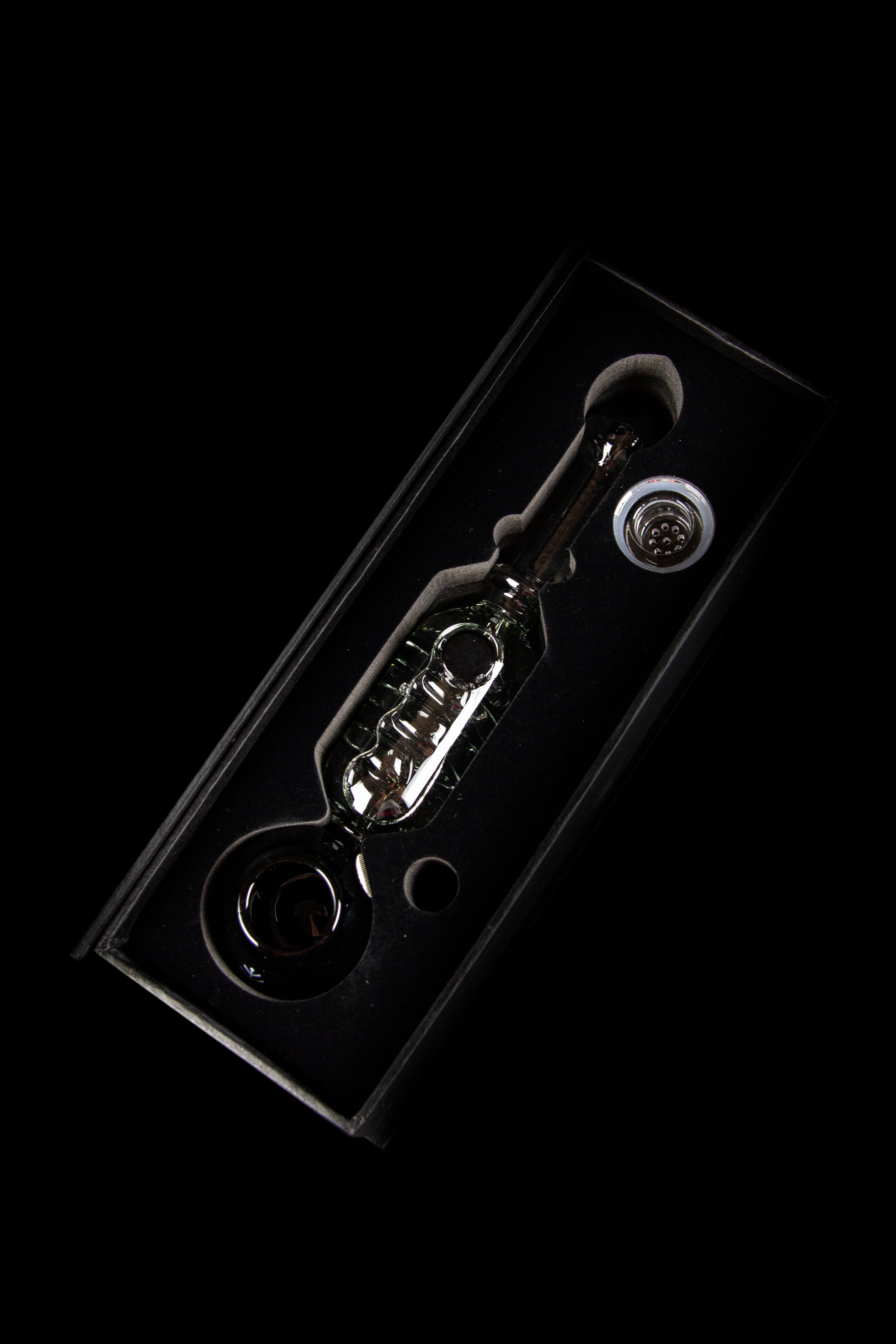 Glass oil rig with bubbler and dome, isolated on black.