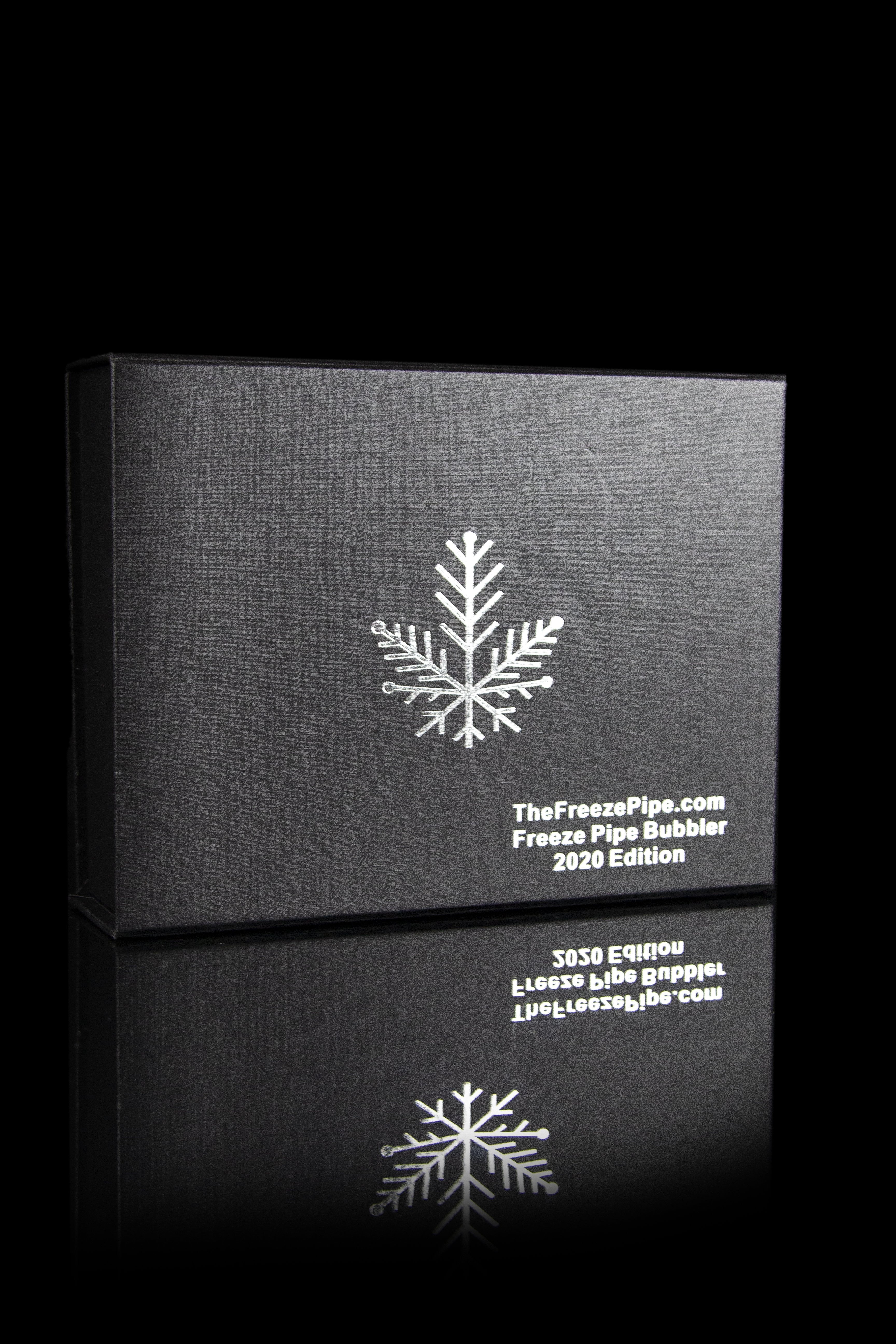 Black box with a snowflake design and text reading “TheFreezePipe.com Freeze Bubbler 2020 Edition.”