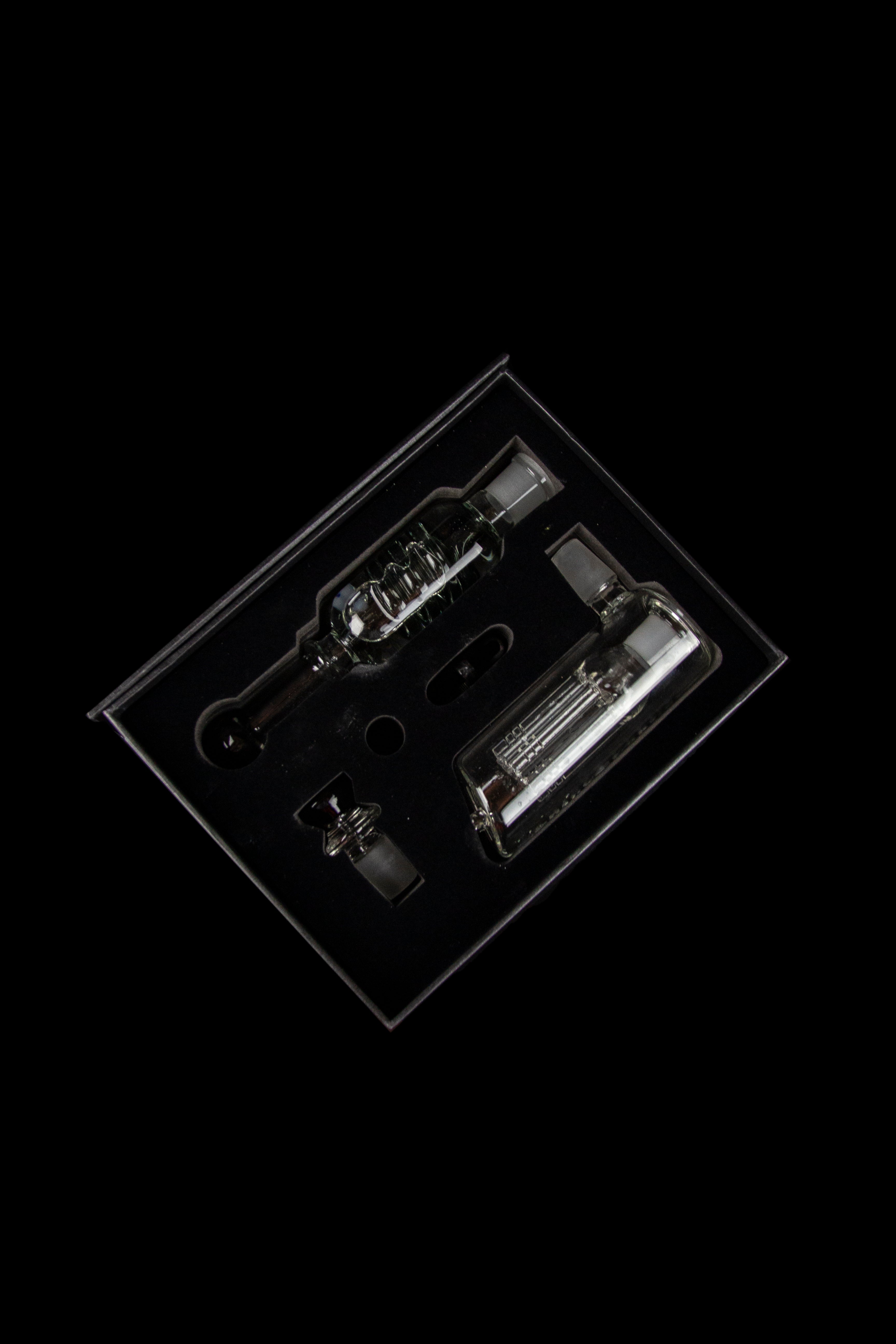 Clear glass dab rig components displayed in a plastic insert.