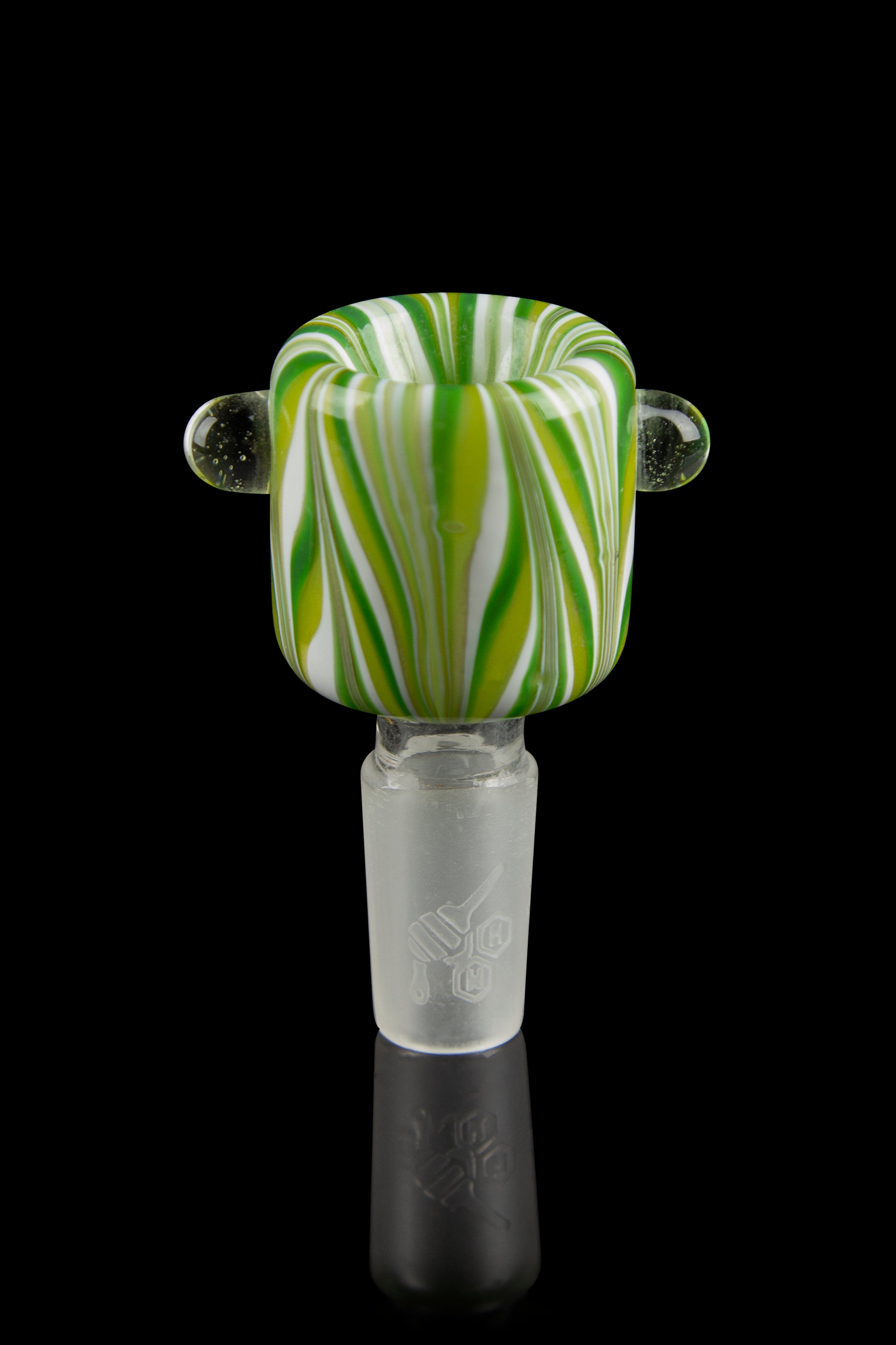 Close-up front view of the Honeybee Herb Wig Wag Flower Bowl showing green, white, and yellow wig‑wag stripes and two clear glass handles against a black background